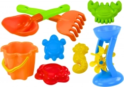 Ensemble coloré de jouets de sable avec moulin et moules