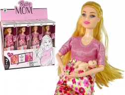 Poupée enceinte en robe rose à fleurs