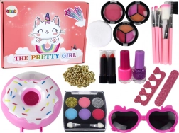 Coffret de maquillage pour enfants avec vernis, fards et accessoires dans une boîte donut