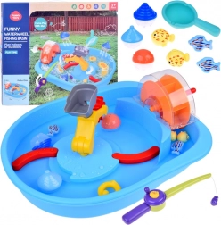 Table bleue d'eau avec roue à aubes et accessoires de pêche
