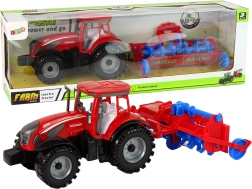 Tracteur rouge avec charrue à propulsion par friction