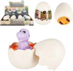 Dinosaure dans un œuf sur roulettes