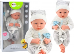 Poupée bébé réaliste en tenue blanc-gris avec bonnet et tétine