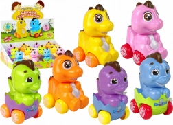 Dinosaure à remontoir dans un œuf sur roulettes