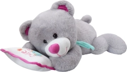 Ourson en peluche gris sur petit coussin
