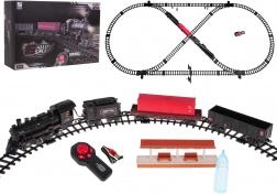 Circuit de train avec locomotive fumante, lumière et musique