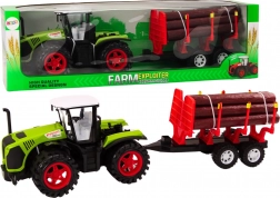 Tracteur agricole vert avec remorque à billes de bois