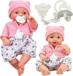 Poupée en tissu avec bonnet et sons