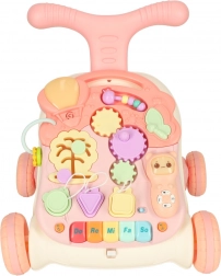 Trois-en-un : trotteur interactif et table d’éveil