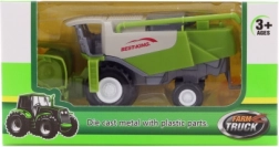 Moissonneuse-batteuse en métal dans une boîte