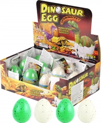 Dinosaure croissant dans l'œuf