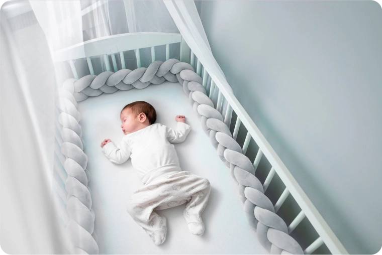 Protection douce dans le lit à barreaux
