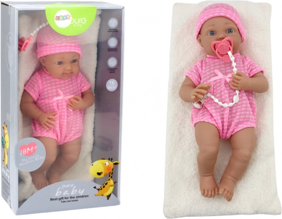 Poupée bébé en tenue rose avec bonnet, tétine et couverture