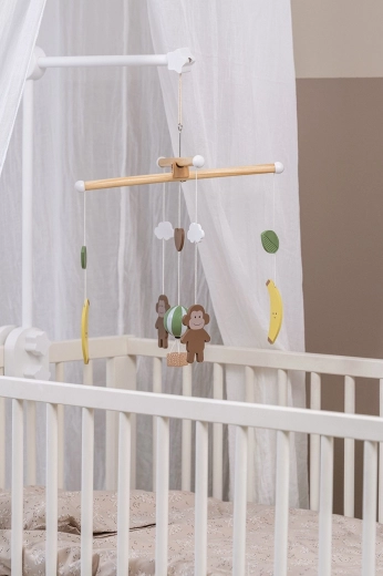 Suspension facile et utilisation au-dessus du lit ou de la table à langer