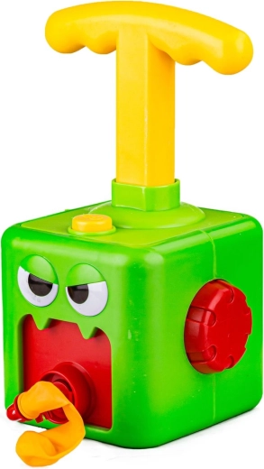 Design ludique de monstre vert et ballons « depuis la bouche »