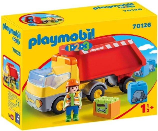 Camion-benne avec ouvrier du bâtiment