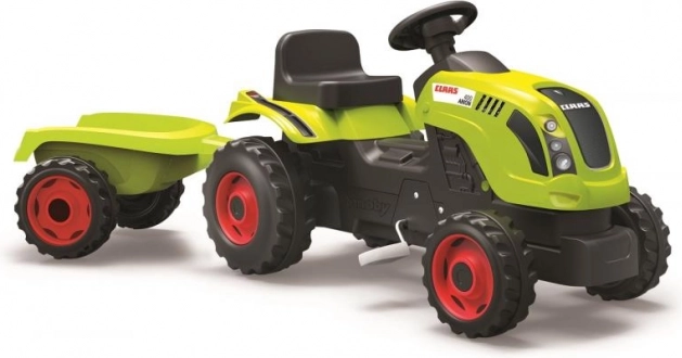 Tracteur à pédales CLAAS avec remorque verte