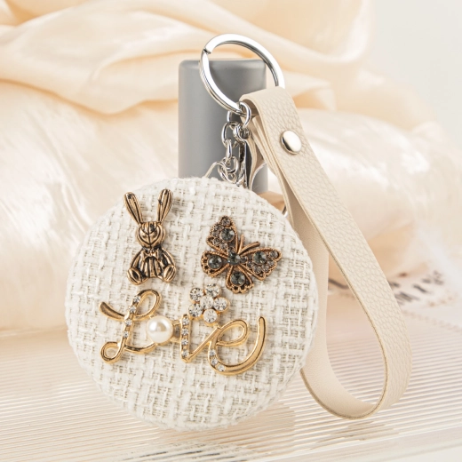Miroir de poche Lapin dans son nid en tweed naturel avec perle