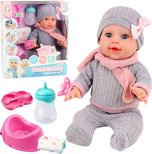 Poupée interactive qui fait pipi 35 cm avec accessoires – biberon et pot