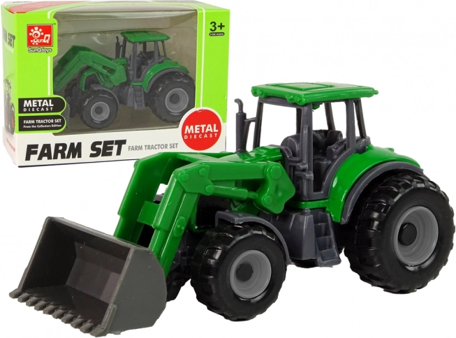 Petit tracteur vert avec chargeur