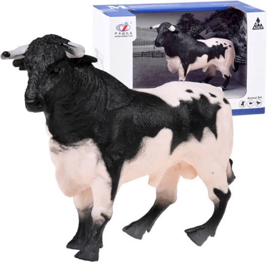 Figurine de taureau noir et blanc de la ferme