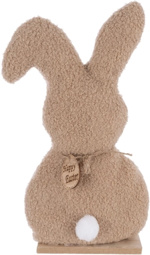 Lapin en peluche douce sur un socle stable