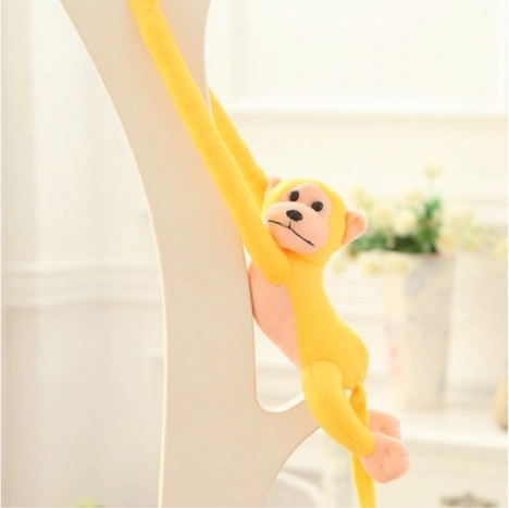 Singe en peluche avec son jaune 60 cm