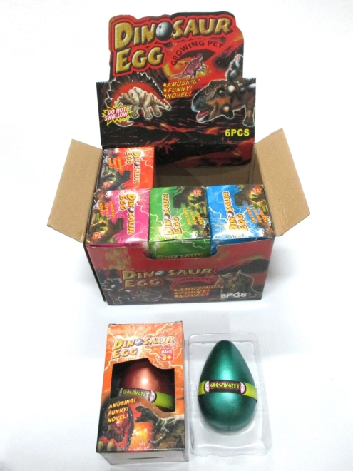 Œuf avec dinosaure qui grandit