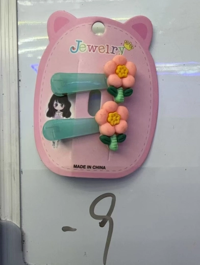 Barrette avec fleur orange