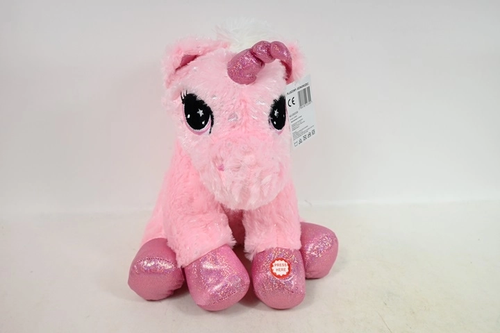 Peluche licorne assise avec son