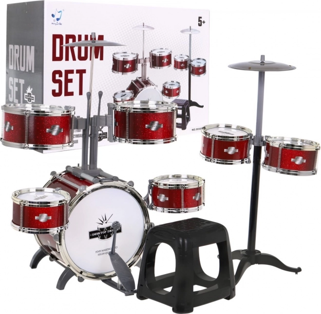Batterie rouge avec 7 tambours + tabouret + 2 cymbales + 2 baguettes - 12 pièces