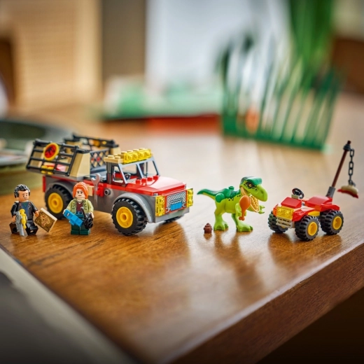Attrapez le bébé T. rex et transportez-le en toute sécurité