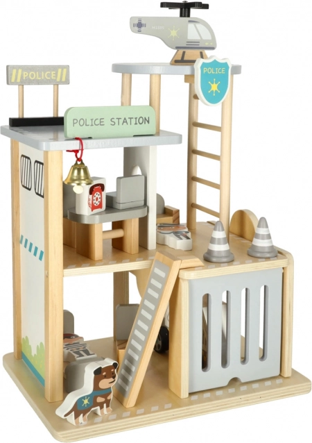 Station de police en bois avec garage, voiture et hélicoptère