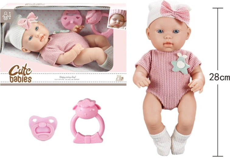 Bébé avec tétine et hochet