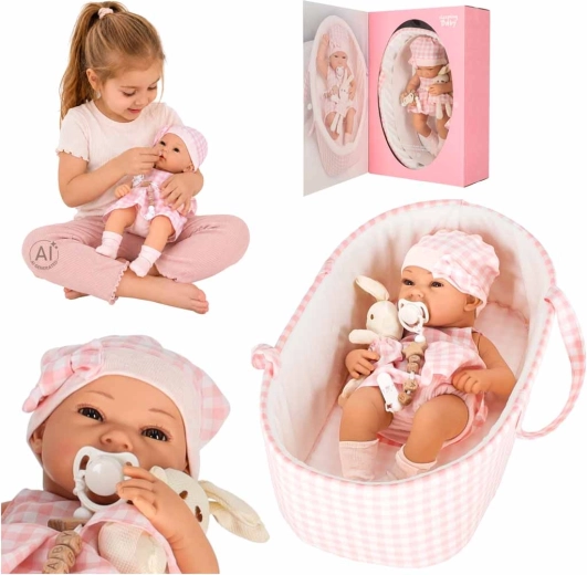 Poupon bébé 38 cm avec couffin de transport et lapin en peluche rose