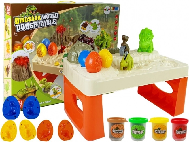 Table de jeu dinosaures avec pâte à modeler et lave lumineuse