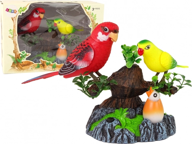 Perroquets chantants et mobiles sur un arbre coloré