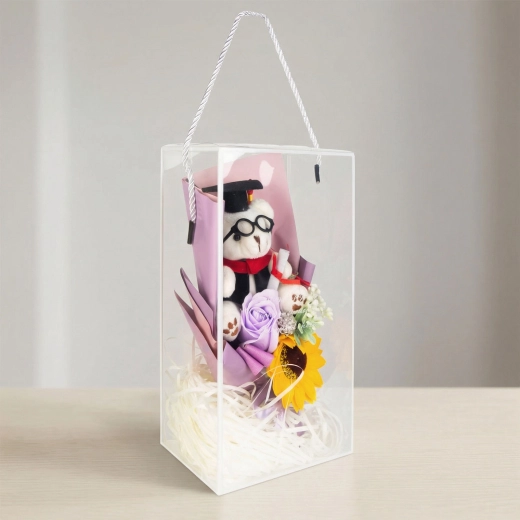 Décoration artificielle avec tournesol et ourson dans une boîte cadeau