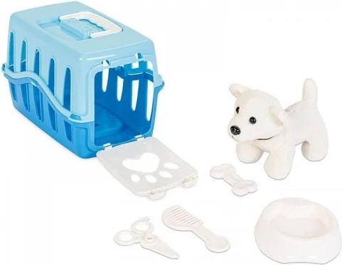 Chiot dans une caisse de transport bleue