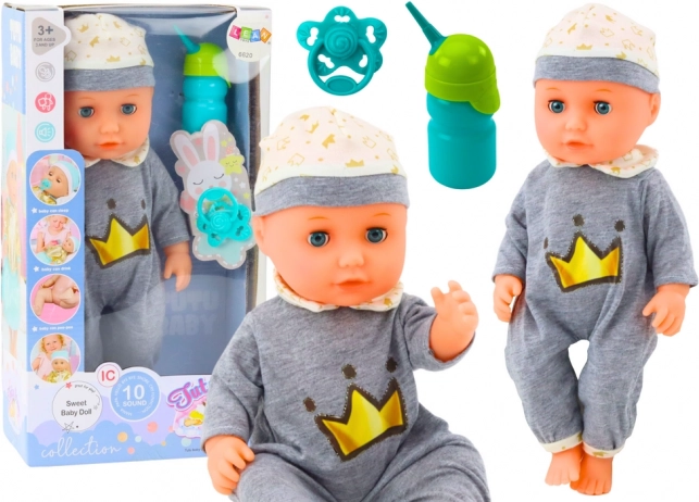 Poupée bébé interactive en pyjama gris
