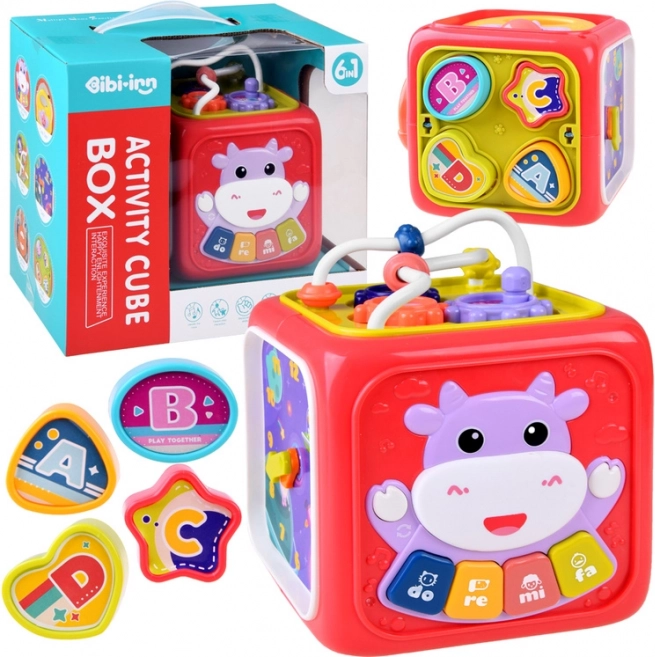 cube éducatif interactif avec piano, labyrinthe et trieur