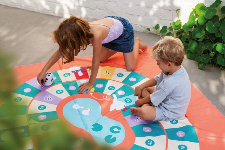 Quut serviette de plage et jeu 2-en-1 Oie XL 180 × 180 cm