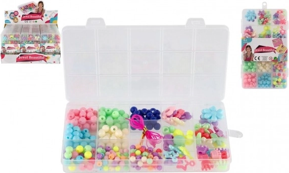 Set de perles en plastique colorées avec cordon dans un organiseur pratique