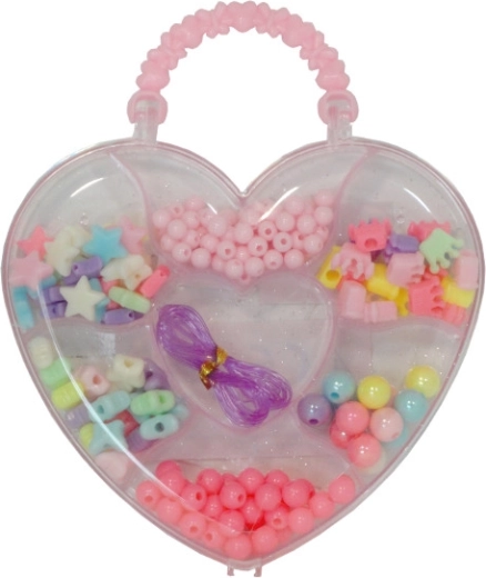 Perles colorées dans une boîte en forme de cœur pour fabriquer des bracelets