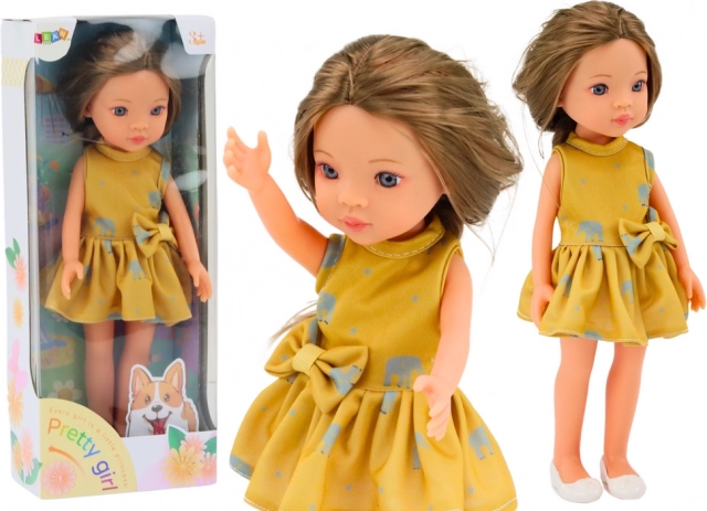 Marionnette en robe jaune avec cheveux bruns 33 cm