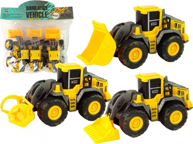 Ensemble de trois véhicules de chantier jaunes