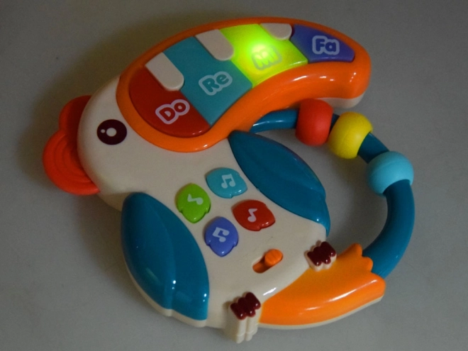 Jouet musical interactif toucan