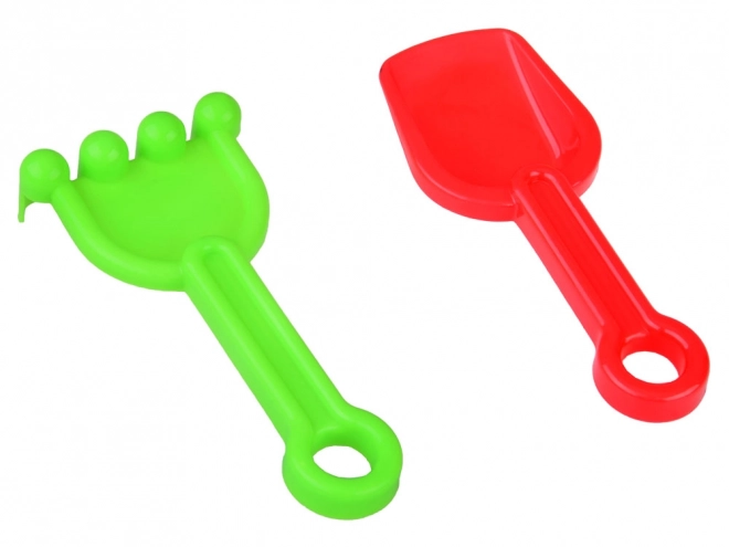 Ensemble coloré de jouets de sable avec seau et moules