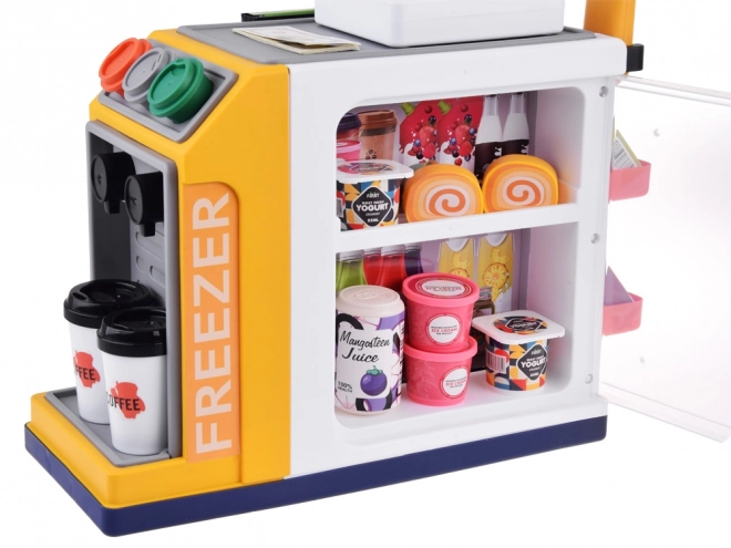 Magasin libre-service avec machine à café et réfrigérateur