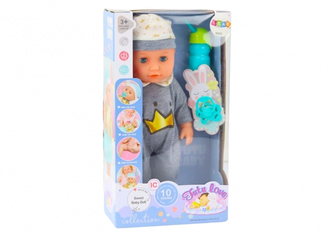 Poupée bébé interactive en pyjama gris